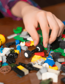 Child playing with Legos