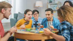a group of teens playing a board game